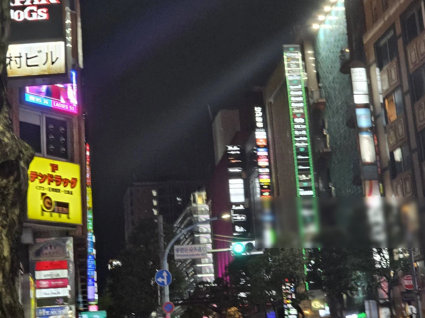 Kabukicho buildings and stacked signboards seen from below at night