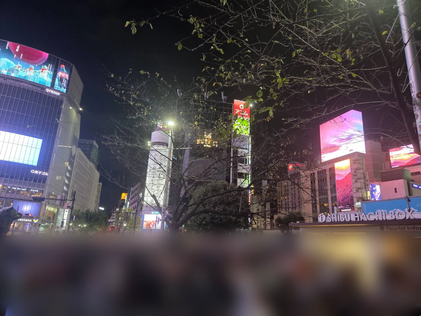 Crowds outside the Hachiko exit of Shibuya station at night