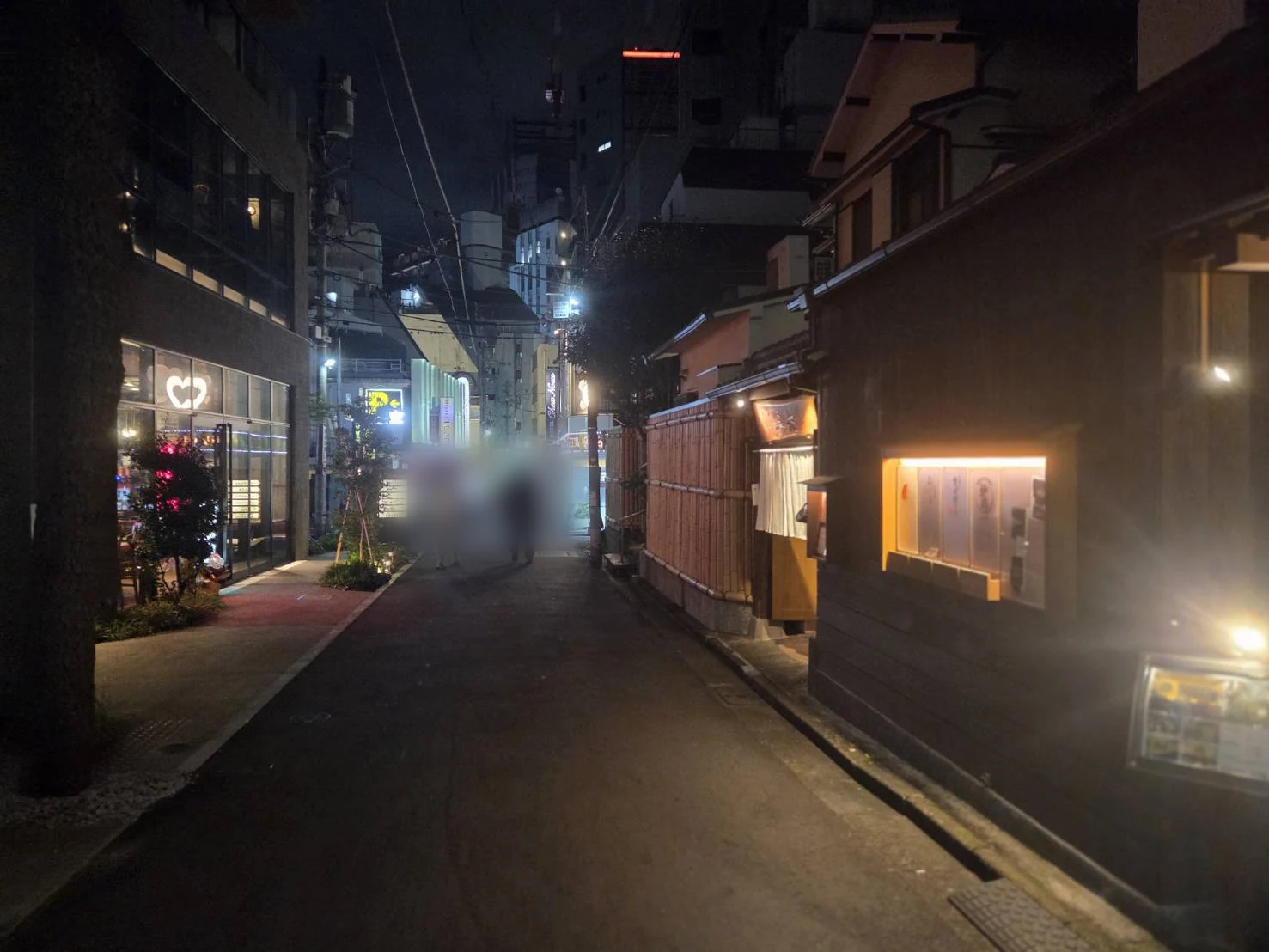 Slope at the entrance to Maruyamacho in Shibuya at night, lined with multi-tenant buildings